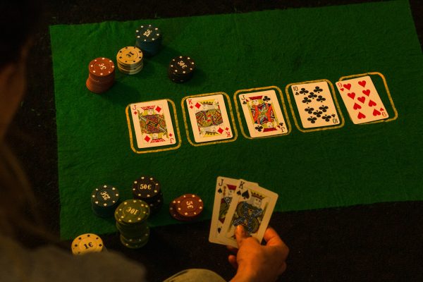 Playing cards and chips on green table