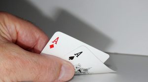 Poker player checking aces