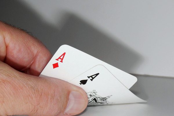 Poker player checking aces