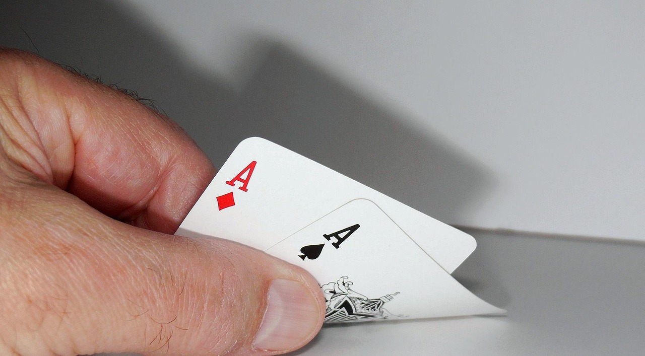 Poker player checking aces