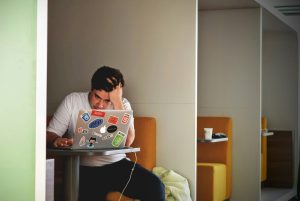 Man frustrated using laptop