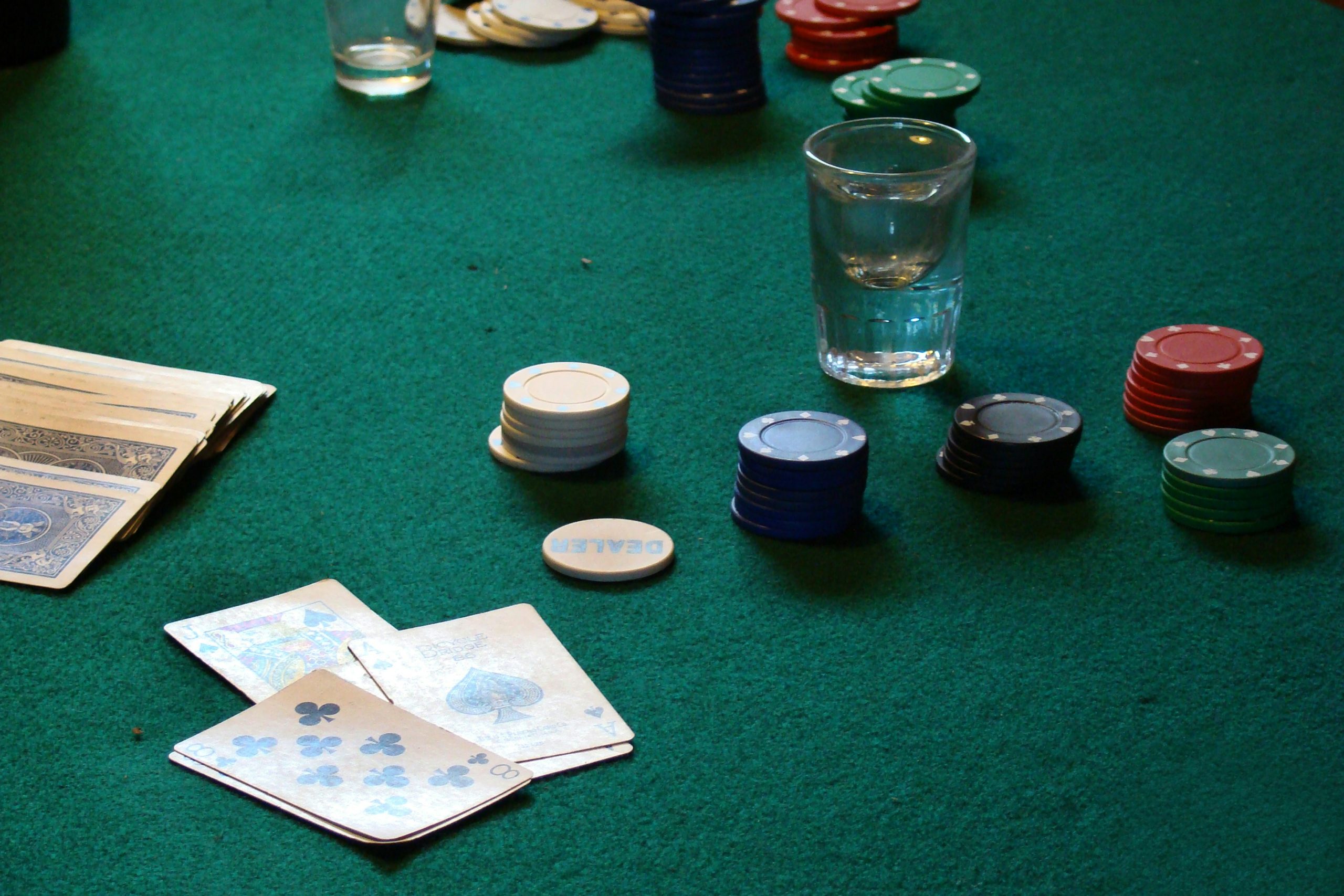 Playing cards and chips on table
