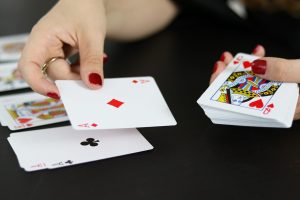 Dealer puts down poker turn card