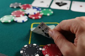 Poker player looking at cards