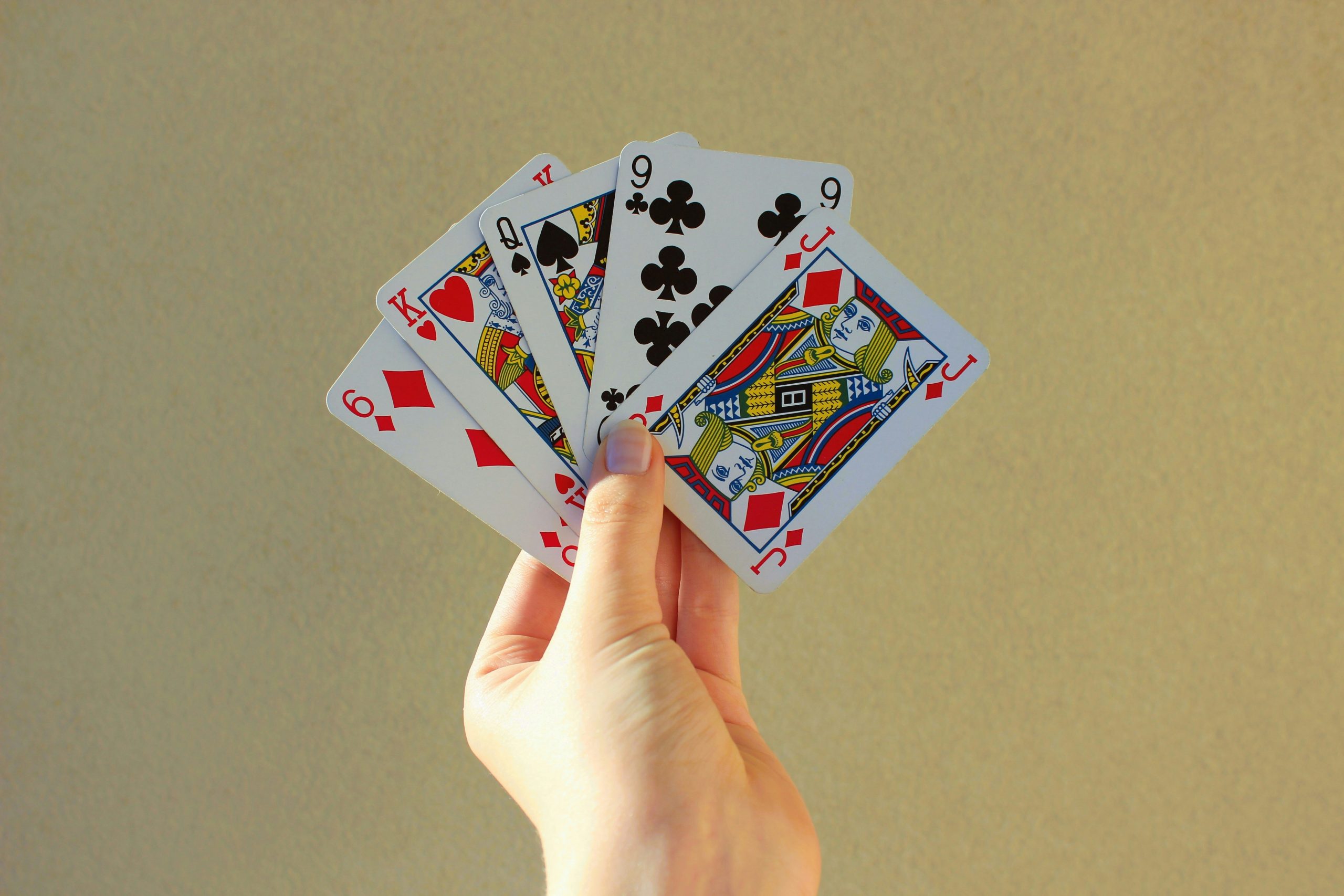 Poker player holding cards